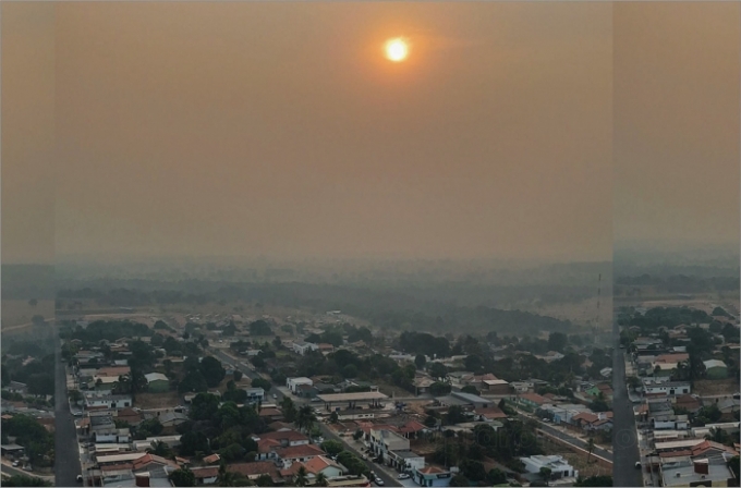 Alcinópolis entardece embaixo de fumaça.